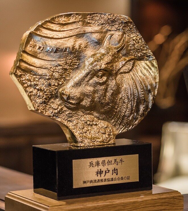 Kobe Beef Marketing and Distribution Promotion Association certification seal statue