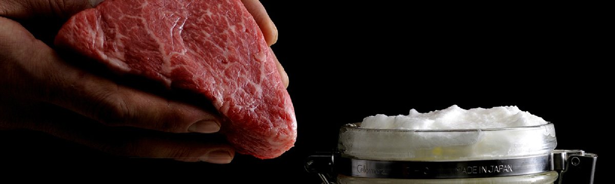 Raw certified Kobe beef showing dense fine marbling