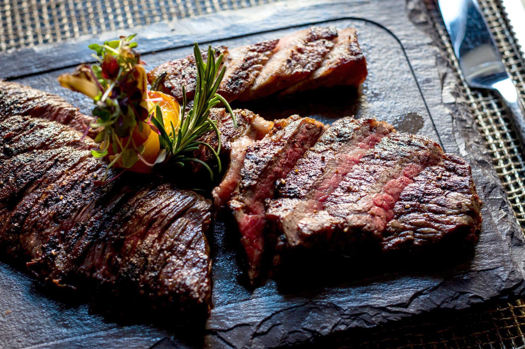 Sliced premium steak selection plated for two at 212 Steakhouse