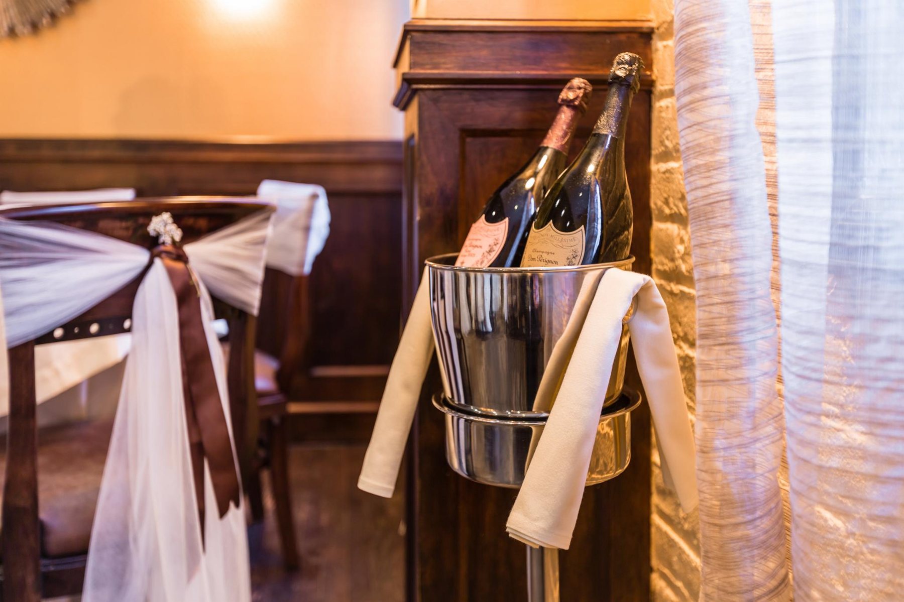 Champagne bucket and glassware prepared for a private celebration
